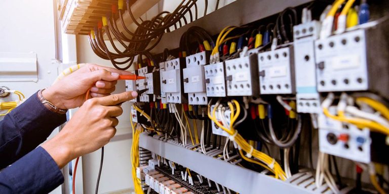 Electrician measurements with multimeter testing current electri
